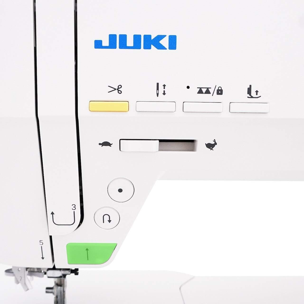 Close-up of a Juki sewing machine with control panel and needle Close-up of a Juki sewing machine with control panel and needle