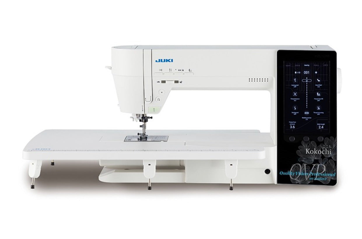 Juki sewing machine with digital display on a white background Juki sewing machine with digital display on a white background