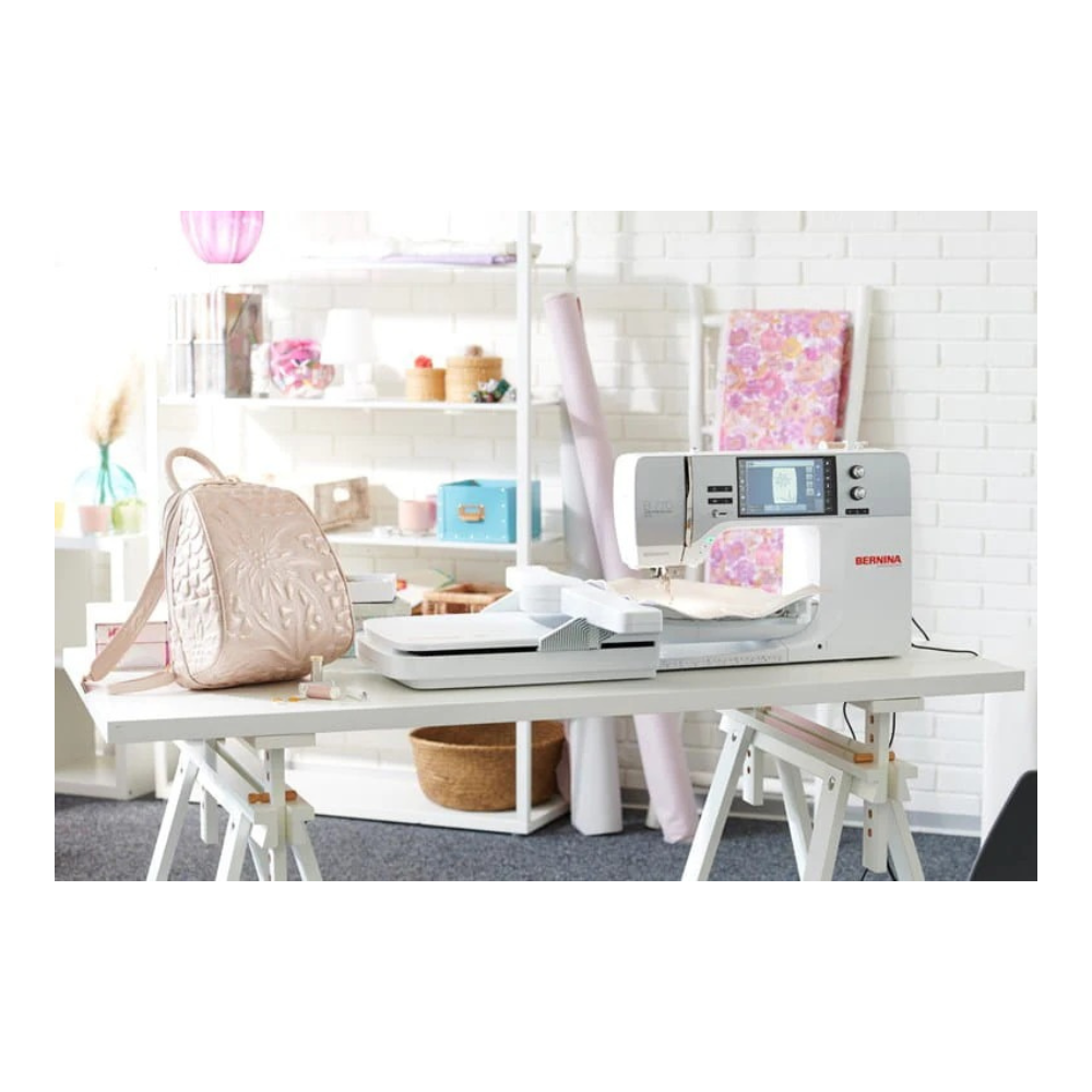 Sewing machine on a table with a white background