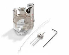 Metallic device with clear plastic component, small probe, and hex key on a white background