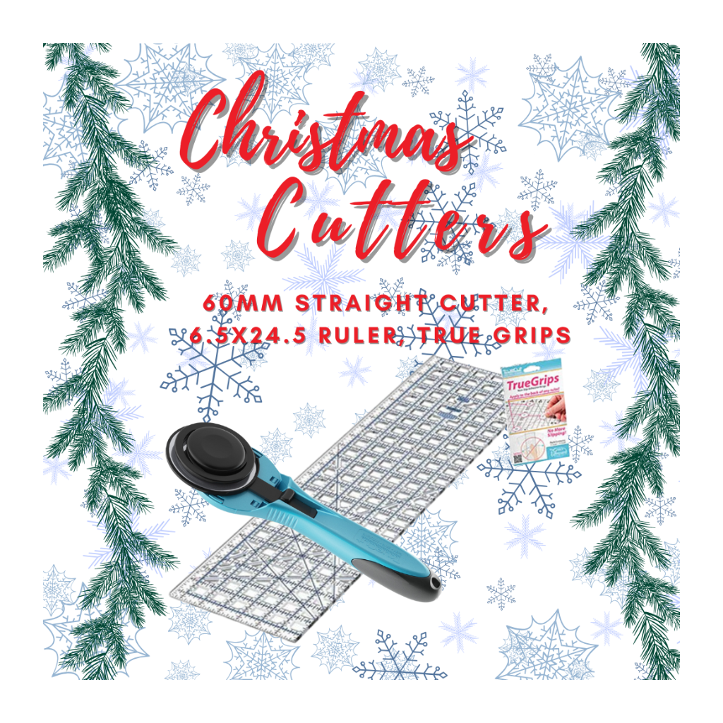 Christmas-themed cutting tool set with ruler and cutter on a decorative background