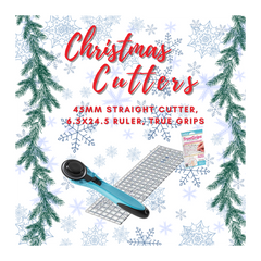 Christmas Cutters set with cutter, ruler, and TrueGrips on a decorative background with trees and snowflakes.