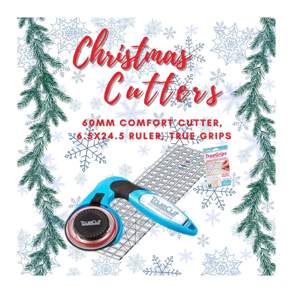 Bluecut Christmas Cutters with ruler and TrueGrips on a decorative background with Christmas trees and snowflakes.