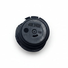 Black rubber grommet with a central hole on a white background